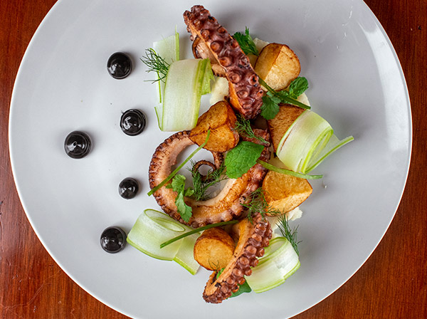 Octopus with roasted potatoes and squid ink mayonnaise